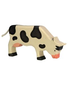 Vache broutant noire